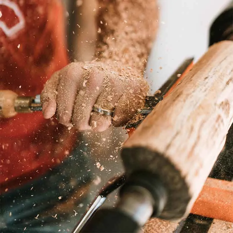 Carpenter working on wooden furniture