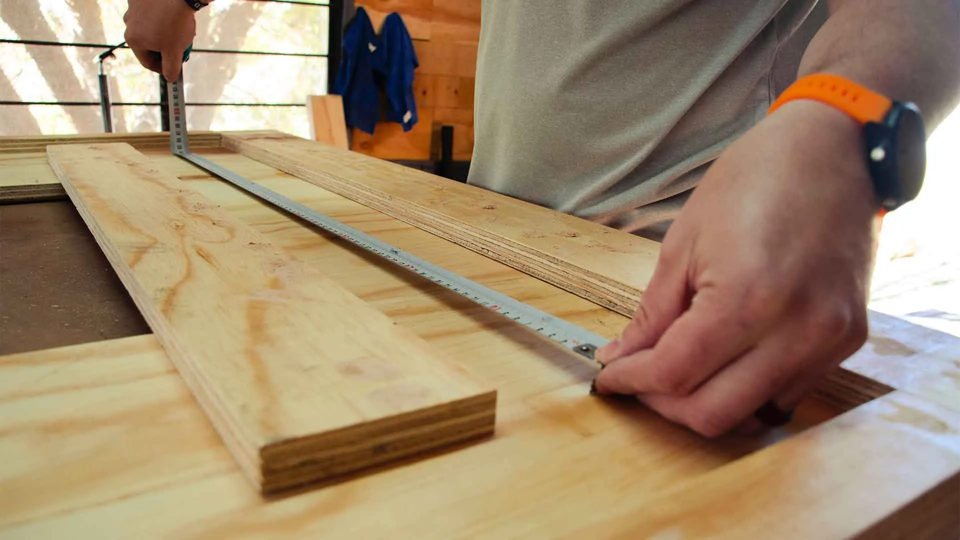 Craftsman fitting a wooden interior element